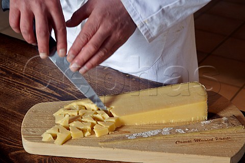 Preparing an older Comt cheese for tasting at Fromageries Marcel Petite Fort Saint Antoine near Malbuisson Doubs France