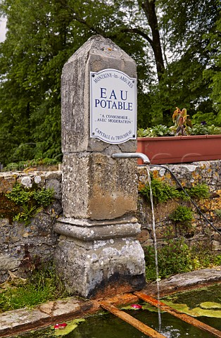 Drinking water fountain stating Capitale du Trousseau in village of MontignylsArsures Near Arbois Jura France