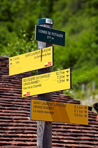 Signs for walking routes in the wine village of Combe de Rotalier Jura France  Ctes du Jura