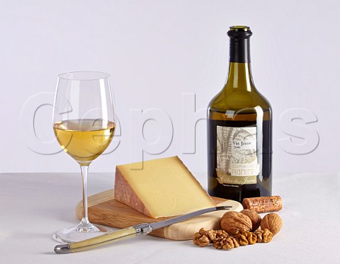Bottle of Domaine Pignier Vin Jaune with Comt cheese and walnuts