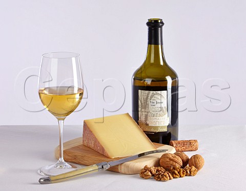 Bottle of Domaine Pignier Vin Jaune with Comt cheese and walnuts