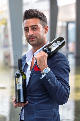 Antonio Cardone winemaker of 750ml with bottles of his Torre dOro  Locorotondo Puglia Italy