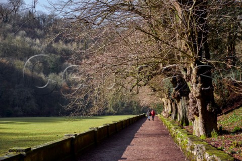 Walkers on the Manifold Trail in Ilam Park Ilam Staffordshire England Peak District National Park