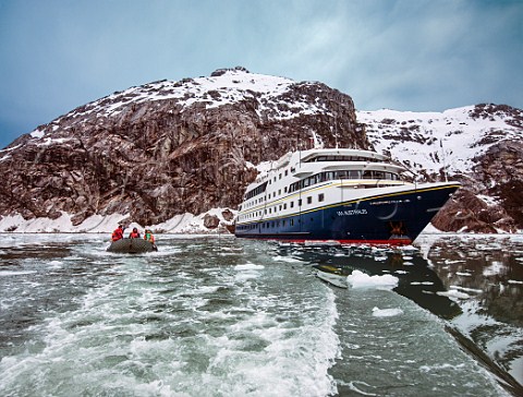Zodiac boat and Via Australis cruise ship in Parry Fjord Patagonia Chile