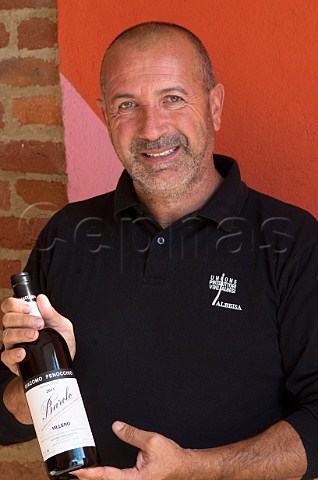 Claudio Fenocchio winemaker of Az Agr Giacomo Fenocchio with a bottle of his 2011 Barolo Villero Monforte dAlba Piedmont Italy Barolo