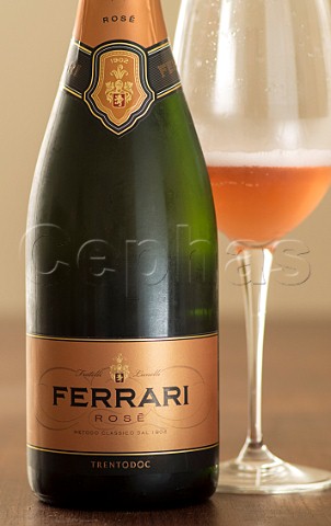 Bottle and glass of Ferrari Ros nonvintage sparkling wine  Trento DOC