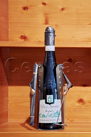Bottle of Jacqure wine in a novelty holder skier in tasting room of Domaine Jean Vullien Frterive Savoie France
