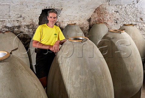 Dominique Belluard died 2021 with the concrete eggs that he uses to age his wines Ayze and Roussette de Savoie les Grandes Jorasses  Domaine Belluard Ayze HauteSavoie France