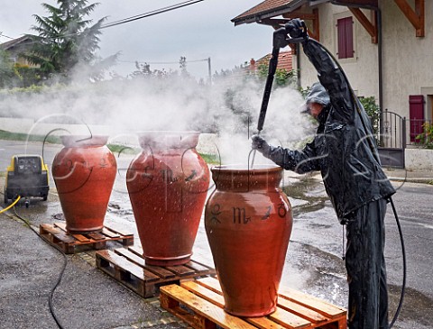 Washing amphorae to remove old beeswax prior to them being resealed ready for the new vintage Les Vignes de Paradis Marcorens Ballaison HauteSavoie France