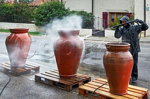Washing amphorae to remove old beeswax prior to them being resealed ready for the new vintage Les Vignes de Paradis Marcorens Ballaison HauteSavoie France