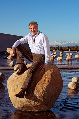 Patrick Valette winemaker with the water and rock art installation at the winery of Via Vik Millahue Chile Millahue Valley