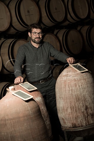 Guillaume Pouthier in barrel cellar of Chteau Les Carmes HautBrion Pessac Gironde France PessacLognan  Bordeaux