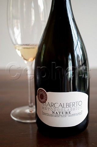Bottle and glass of Marcalberto Brut Nature Santo Stefano Belbo Asti Piedmont Italy