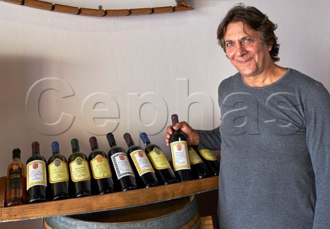 Evriviadis Sclavos with the range of wines on display in the tasting room of his winery Lixouri Paliki Peninsula Cephalonia Ionian Islands Greece