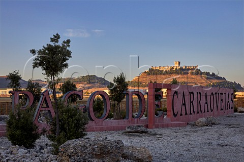 Sign of Pago de Carraovejas with the Castillo de Peafiel beyond Peafiel Castilla y Len Spain  Ribera del Duero