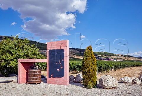 Tourist information in vineyard of Pago de Carraovejas with the winery beyond Peafiel Castilla y Len Spain  Ribera del Duero