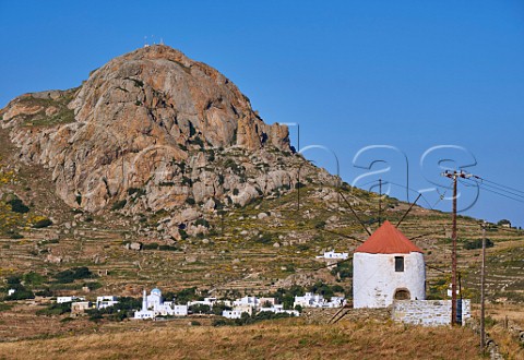Windmill and village of Xinara below Mount Exomvourgo Tinos Greece