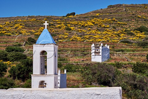 Chapel at Tarampados with one of the numerous dovecots near the village Tinos Greece