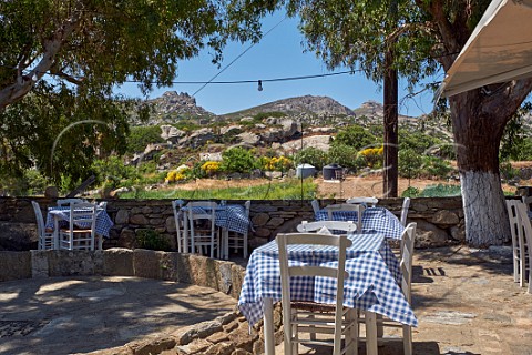 Taverna tables set for lunch in the village of Volakas Tinos Greece