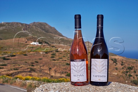 Two wines of Vaptistis Winery with the view from the new tasting room  Steni Tinos Greece