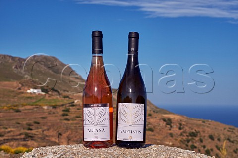 Two wines of Vaptistis Winery with the view from the new tasting room  Steni Tinos Greece
