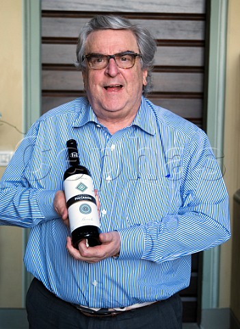 Pio Boffa died 2021 of Pio Cesare with a bottle of his Barolo from the Mosconi vineyard in Monforte dAlba  Piemonte Italy
