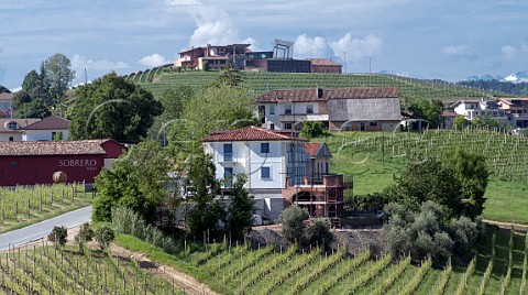 The Ceretto winery atop the Bricco Rocche cru seen from the Bricco Boschis cru  Castiglione Falletto Piedmont Italy Barolo