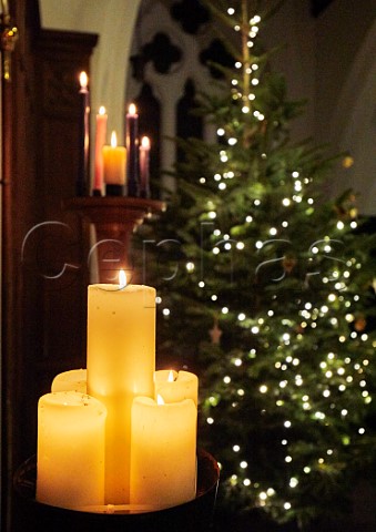 Christmas tree and Advent candles St Marys Church East Molesey Surrey England