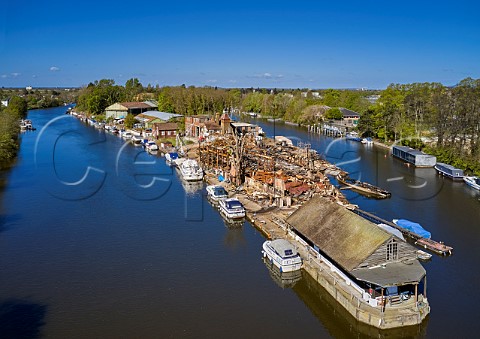 Platts Eyot after the fire of 3 May 2021 which destroyed the boat shed of Otter Marine and the Dunkirk evacuation ship Lady Gay The River Thames at Hampton Middlesex England
