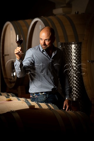 Paul Garcin in barrel cellar of Chteau HautBergey Lognan Gironde France  PessacLognan  Bordeaux