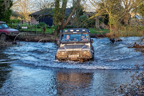 Land Rover fording the River Wensum at Shereford Norfolk England