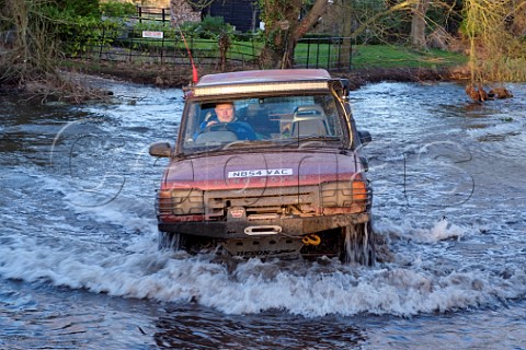 Land Rover fording the River Wensum at Shereford Norfolk England