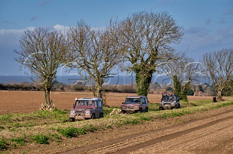 Land Rovers on a green lane near WellsnexttheSea with the North Sea in distance Norfolk England