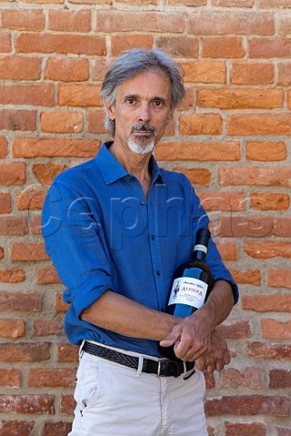 Mario Oliveri with bottle of Alfiera Barbera dAsti  Marchesi Alfieri San Martino Alfieri Piemonte Italy