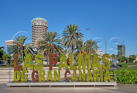 Floral sign in Las Palmas with the Marriott AC Hotel beyond Gran Canaria Canary Islands Spain