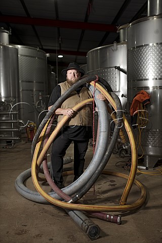 Michael J Corbett with racking hoses Vanguardist Wines Seppeltsfield South Australia  Barossa Valley